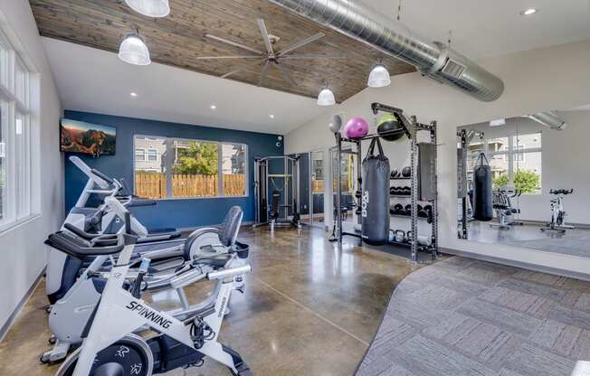 Spacious Fitness Center with Cardio Equipment, Free Weights and Boxing Bag