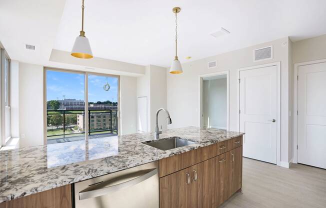 a kitchen with granite counter tops and a sink