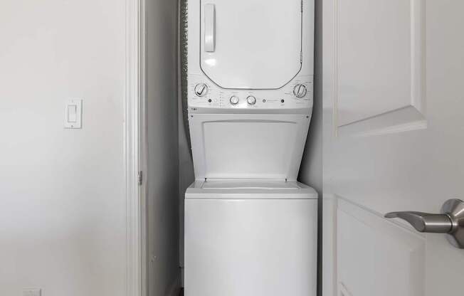 A white toilet and sink in a small bathroom.