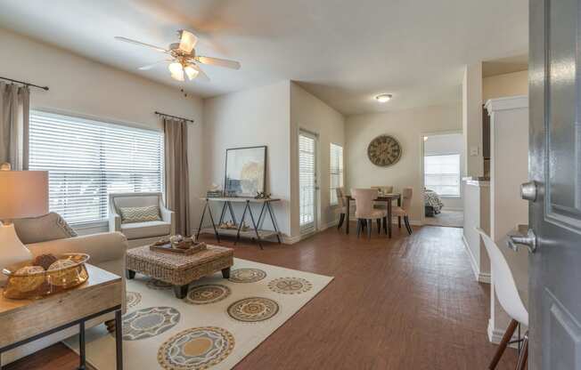 Spring TX Apartments - Edgewater at Klein - Spacious Living Room with Wood-Style Flooring and a Dining Nook