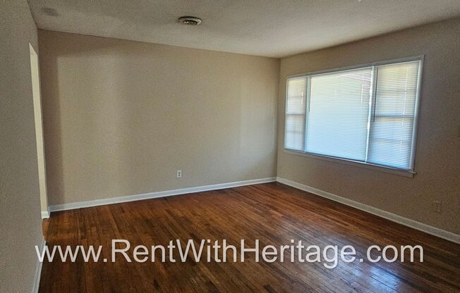 Great Brick Ranch / Harwood Floors / Huge Shop or Extra Storage / No Garage / Great Private Back Yard/ Great Location