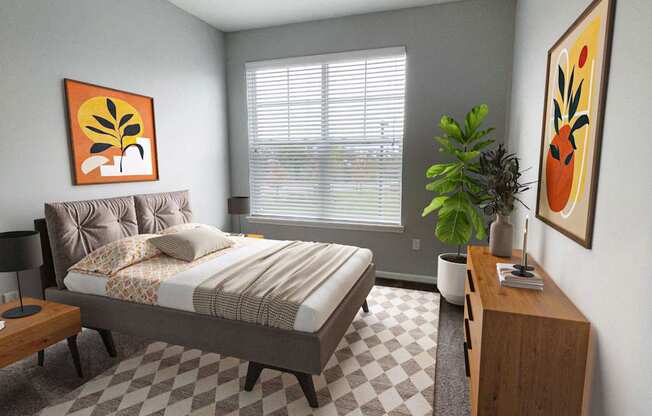 A bedroom with a bed, nightstand, and a plant.