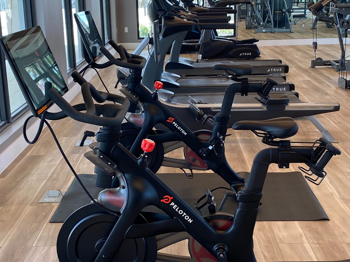 A row of exercise bikes are lined up in a gym at Portofino Vineyards Apartment, Fort Myers, Florida