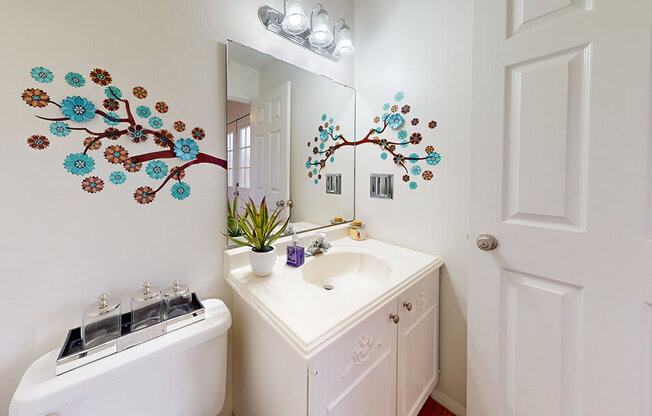 a white bathroom with a sink and a mirror