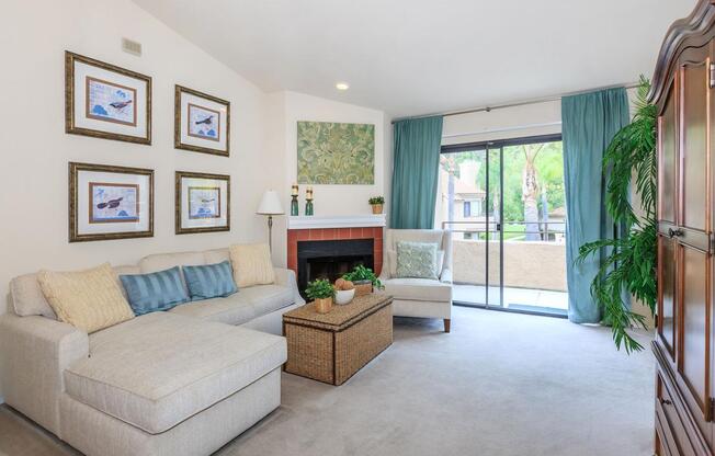 a living room filled with furniture and a large window