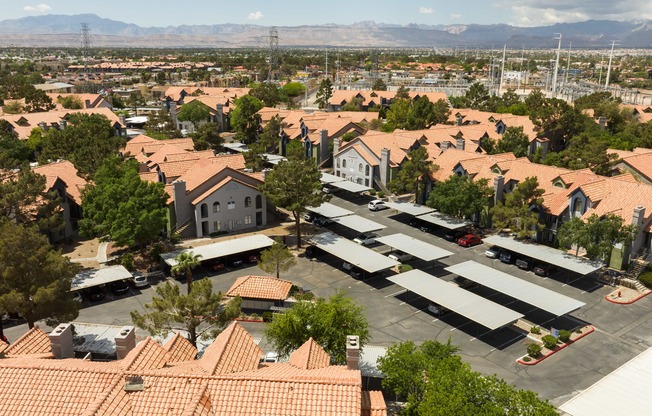 an aerial view of a suburban neighborhood with houses and cars