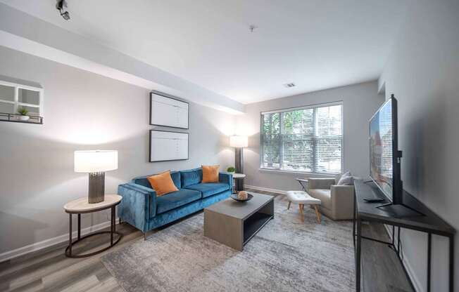 a spacious living room with a large window at Harbor Pointe, Bayonne, New Jersey