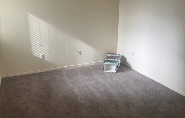 a view of a hallway with a towel hanging on the wall