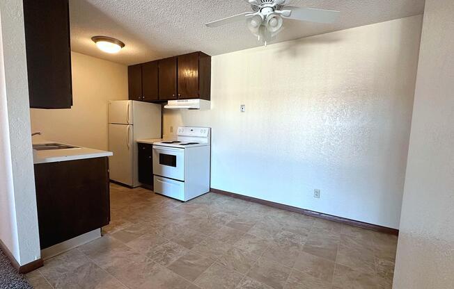 a kitchen with a sink and a refrigerator