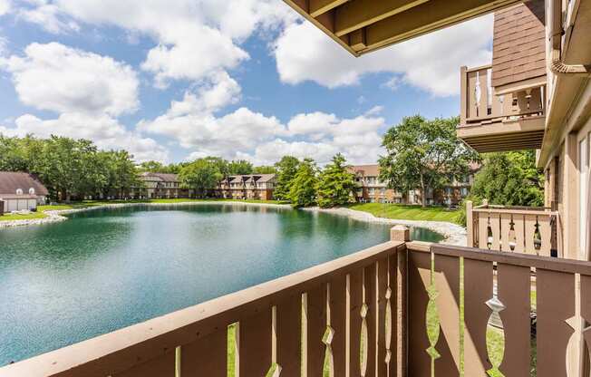 A view from a balcony overlooking a lake