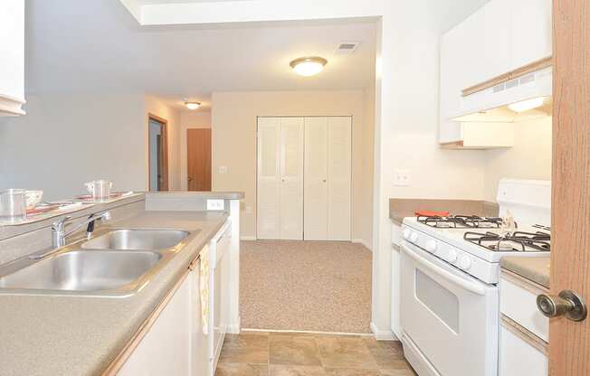 Kitchen with Light Grey Countertops and Tile Style Flooring