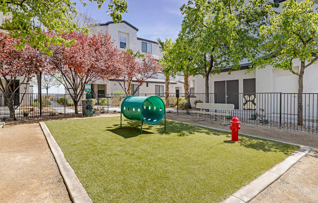 Unleash the ultimate in pet-friendly luxury at The Michael B! Our gated dog park offers a serene retreat with shaded trees and a cozy bench for you and your furry friend to relax and enjoy the day.at