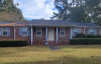 Spacious ranch with large back yard and screened in rear porch