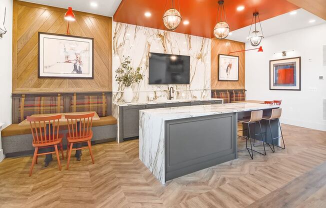 a restaurant with a kitchen and a table and chairs