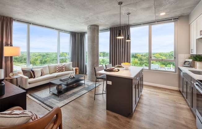 a living room and kitchen with a view of the city