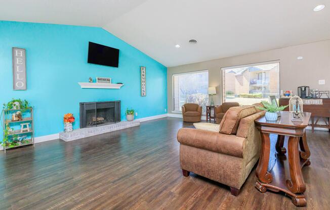 a living room filled with furniture and a large window