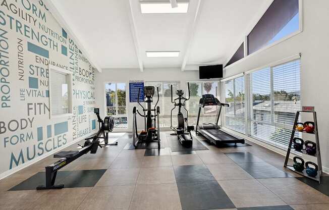 Community Fitness Center with Equipment at Colonnade at Fletcher Hills Apartments in El Cajon, CA.