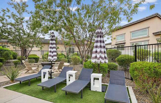 A playground with slides and a swing set.