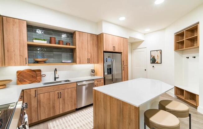 Savor a stylish kitchen at Modera St. Paul, featuring warm wood cabinetry, sleek countertops, and an island perfect for dining or entertaining in Dallas.