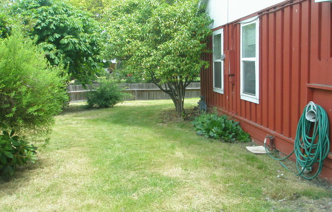 House with garage, carport, yard, & shed