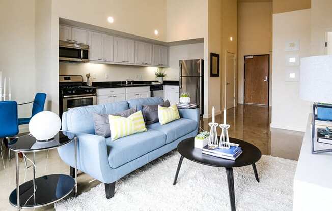 staged living room with view of kitchen