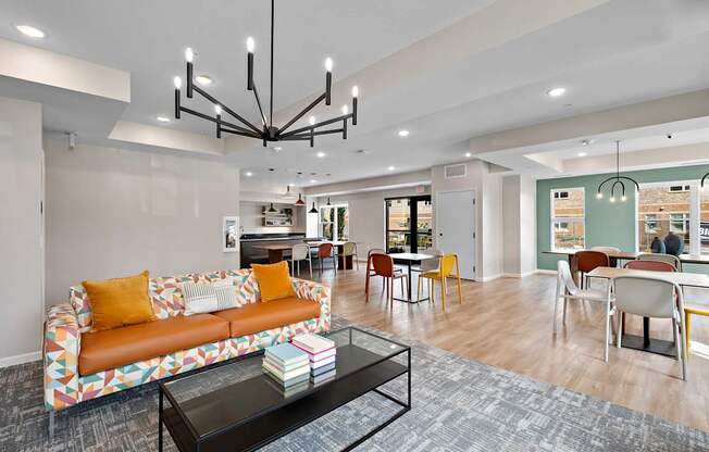 A living room with a sofa, chairs, and a coffee table.