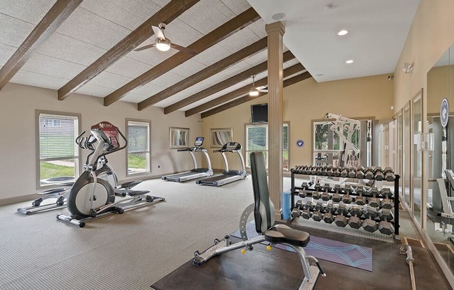 a gym with a lot of exercise equipment in it