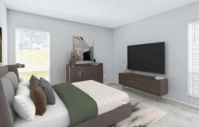 Bedroom with a bed and a television at Lakes Edge Apartments, Greensboro, North Carolina