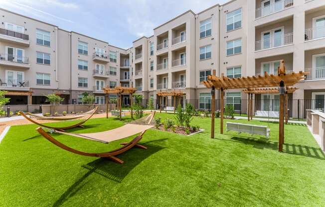 Courtyard with hammocks at Residences at 3000 Bardin Road, Grand Prairie, TX