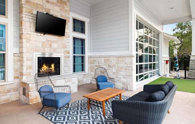 Outdoor Lounge with Fireplace and Comfy Seating