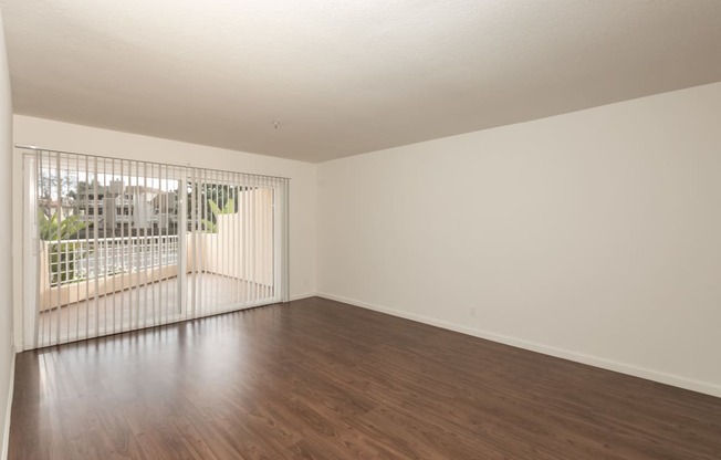 Living Room with Hardwood Floors and Patio Doors
