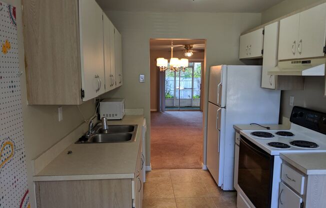2/2 Flat with Assigned Parking, Screen Porch, Inside Laundry