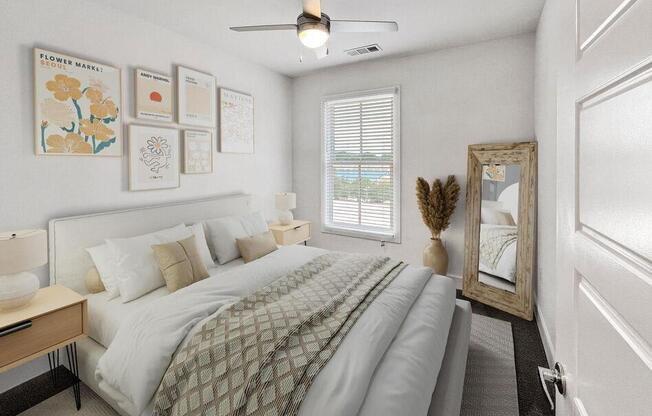 a bedroom with a bed and a ceiling fan at The Merchant Apartments, Charleston, South Carolina