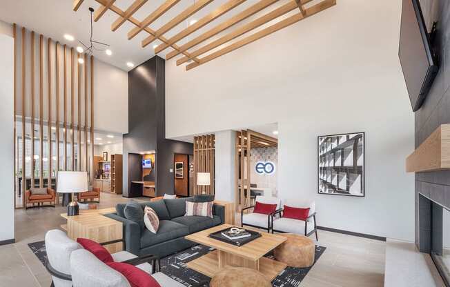 a living room with a couch and chairs and a table