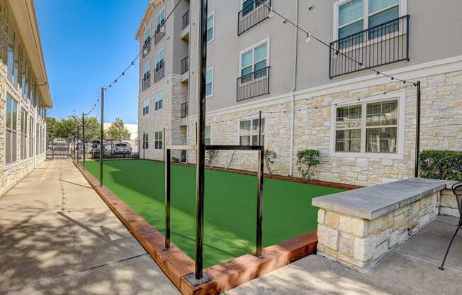 our apartments have a spacious courtyard with a green lawn and a basketball court