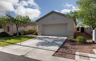 Wonderful Summerlin single story with grass backyard and island kitchen.