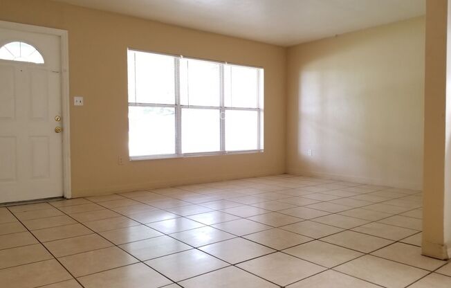 Charming 3-Bedroom Home with Spacious Backyard and One-Car Garage.