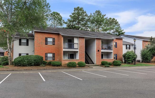 an empty parking lot in front of a house