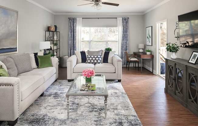 a living room with couches and a coffee table