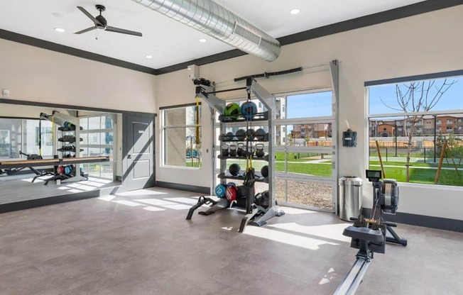 Fitness center with weights at Glen 91 Apartments in Glendale, AZ