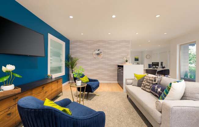 a living room filled with furniture and a flat screen tv