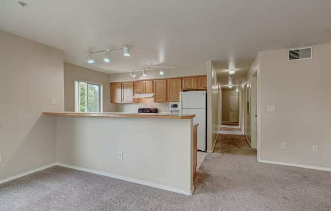 Kitchen with appliances and cabinets at River Walk Apartments, Boise, Idaho