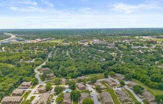 an aerial view of a neighborhood with houses and trees