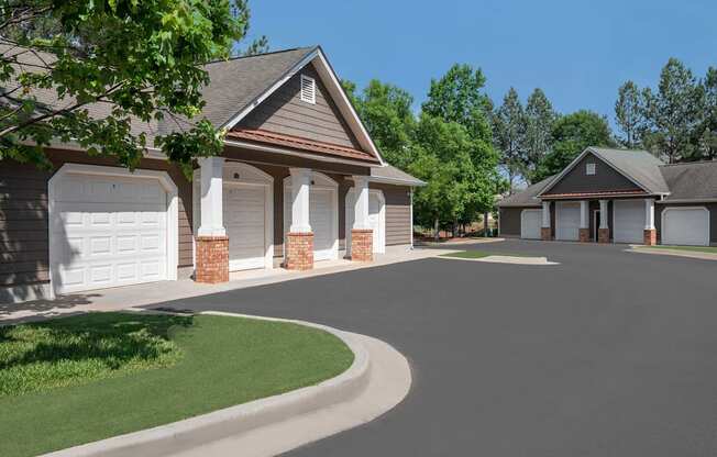 A house with a driveway and garage doors.