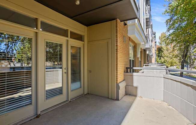 Flatiron West Trade Apartments patio with cement flooring
