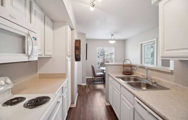 spacious kitchen with white cabinets at Dakota Ridge apartments