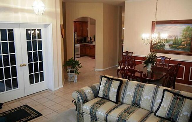 This meticulously maintained, smoke-free home offers an exceptional layout with soaring high ceilings, extensive tile flooring, and fresh neutral paint throughout.