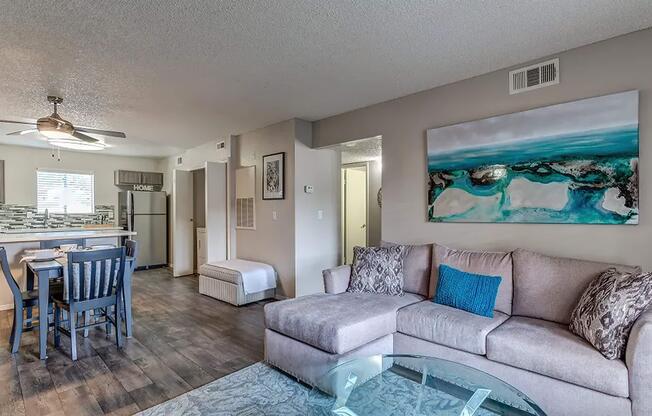 a living room filled with furniture and a table