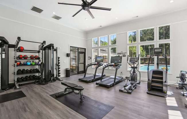 A spacious home gym with a variety of exercise equipment.