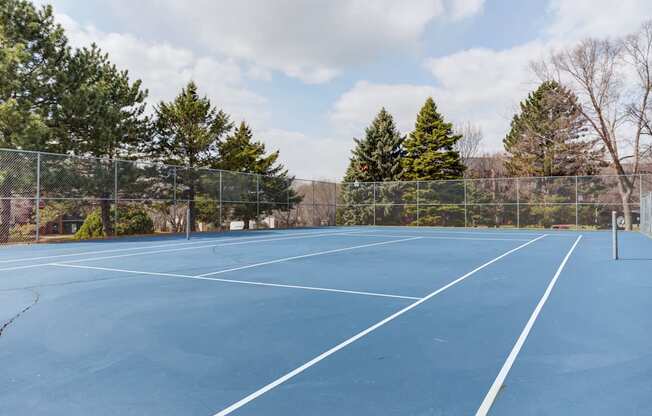 a tennis court at the reserve at riverdale apartments in riverdale, nj